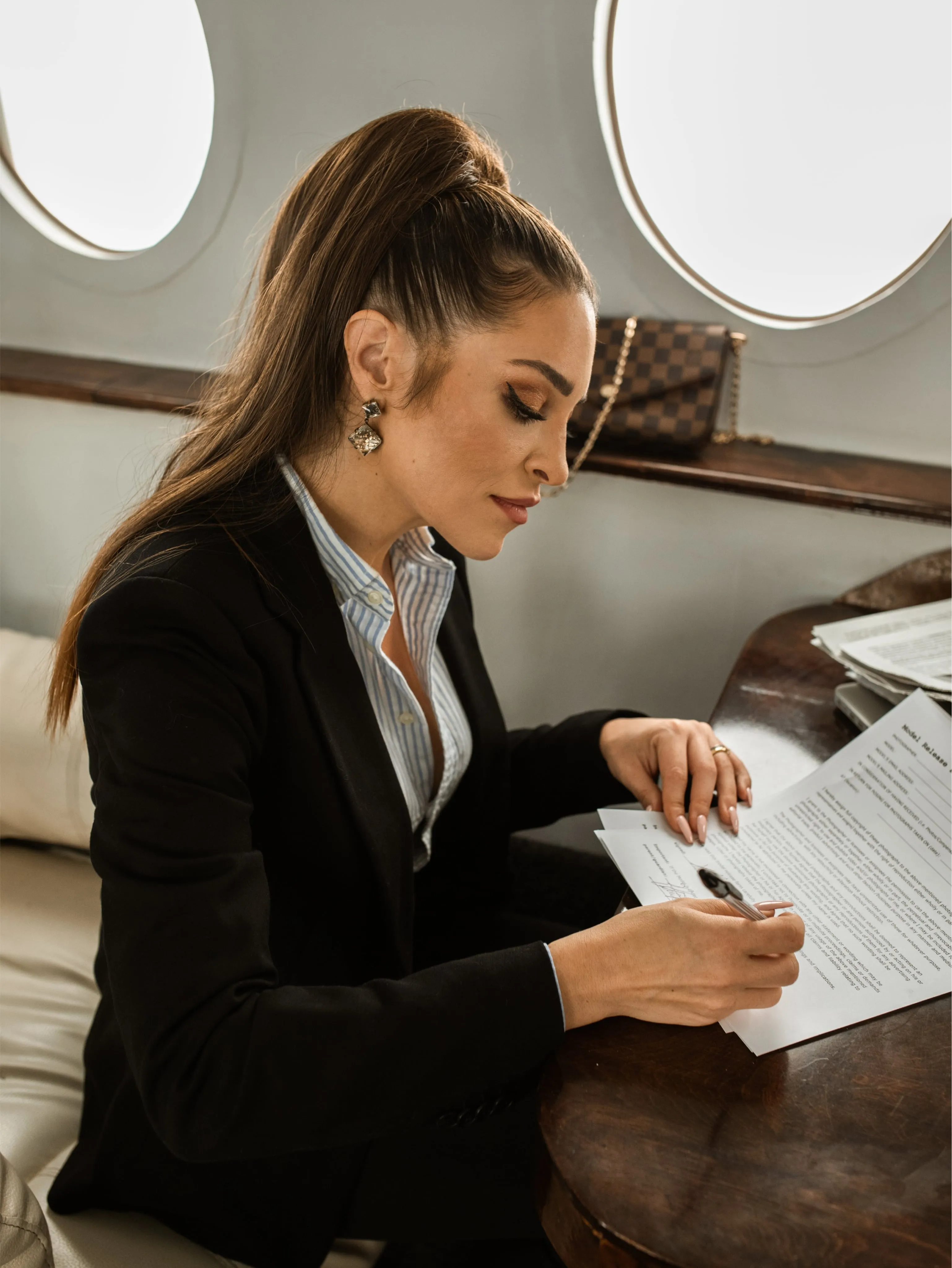 A woman signing paperwork